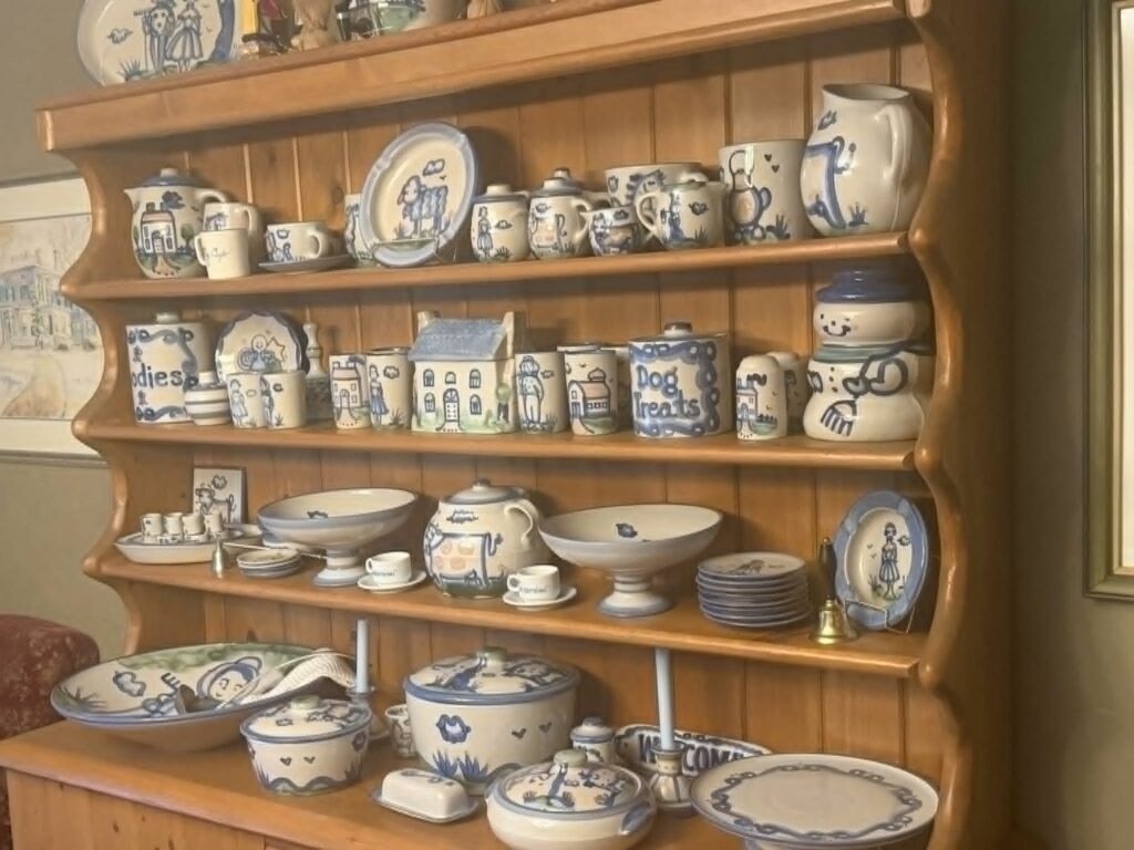 Estate sale items neatly arranged on display in a home